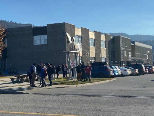 Students congregate outside Princess Margaret Secondary School over the lunch hour on Wednesday. Some were not physically distant or wearing masks.