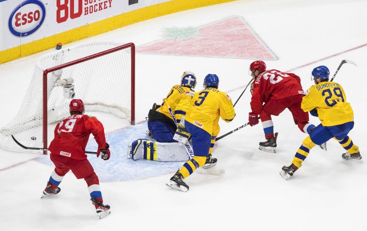 Russia's Marat Khusnutdinov (22) scores a goal against Sweden goalie Jesper Wallstedt (1) during overtime IIHF World Junior Hockey Championship action in Edmonton on Wednesday, December 30, 2020. 