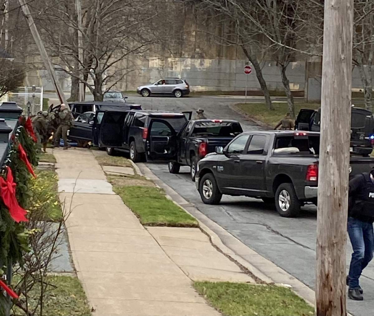 Nova Scotia RCMP take part in an organized crime and drug bust investigation on Dec. 9, 2020. Visible in the photo is a power pole, damaged during the vehicle chase.