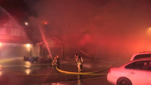 Calgary firefighters battle a house fire in the 100 block of Royal Oak Terrace Northwest on Monday, Dec. 7, 2020.