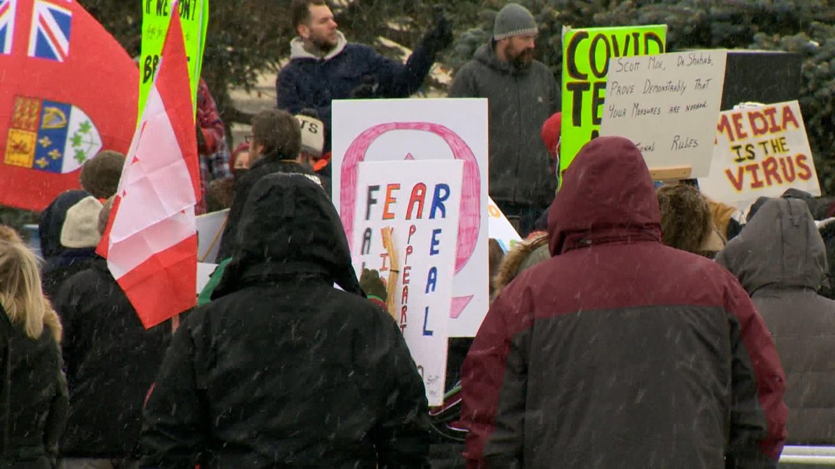 Hundreds protest against current public health orders at a rally in Regina on Saturday, Dec. 12, 2020.