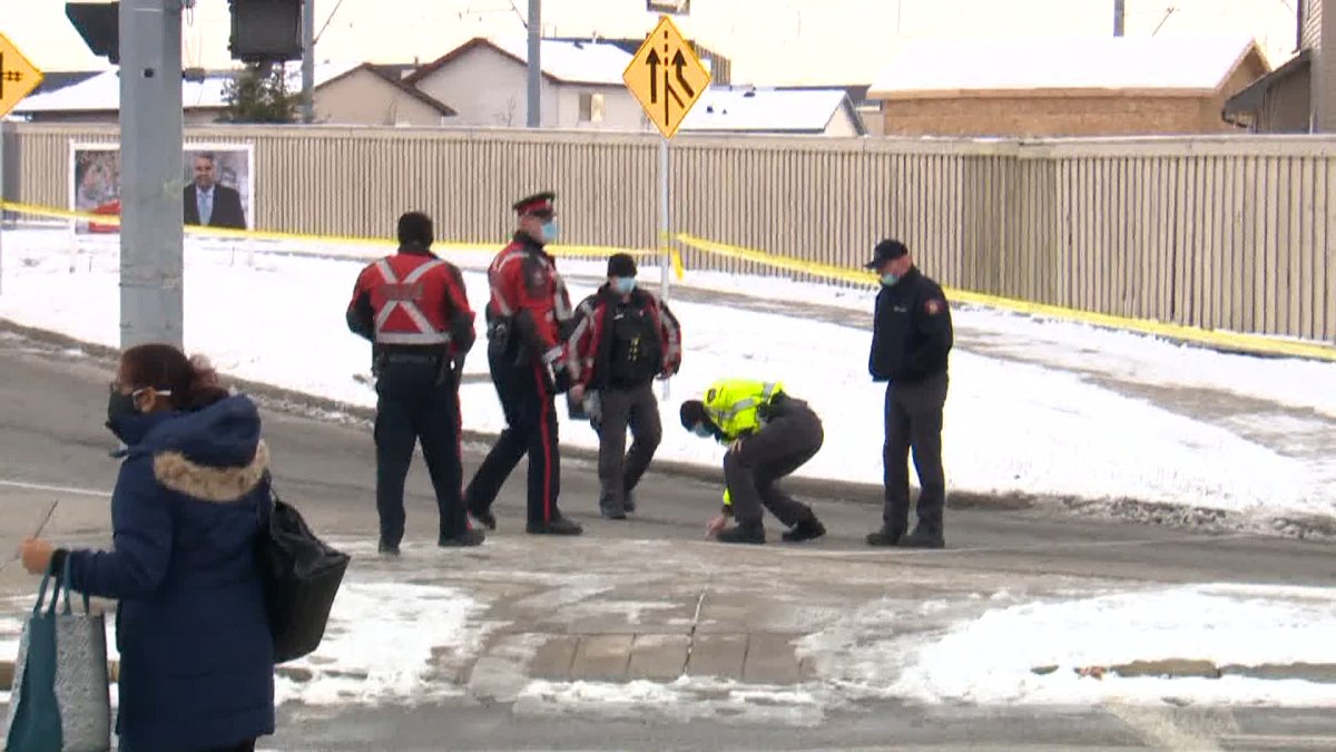 Calgary police at the scene of a crash involving a cyclist and a vehicle in northeast Calgary on Tuesday, Dec. 15. 