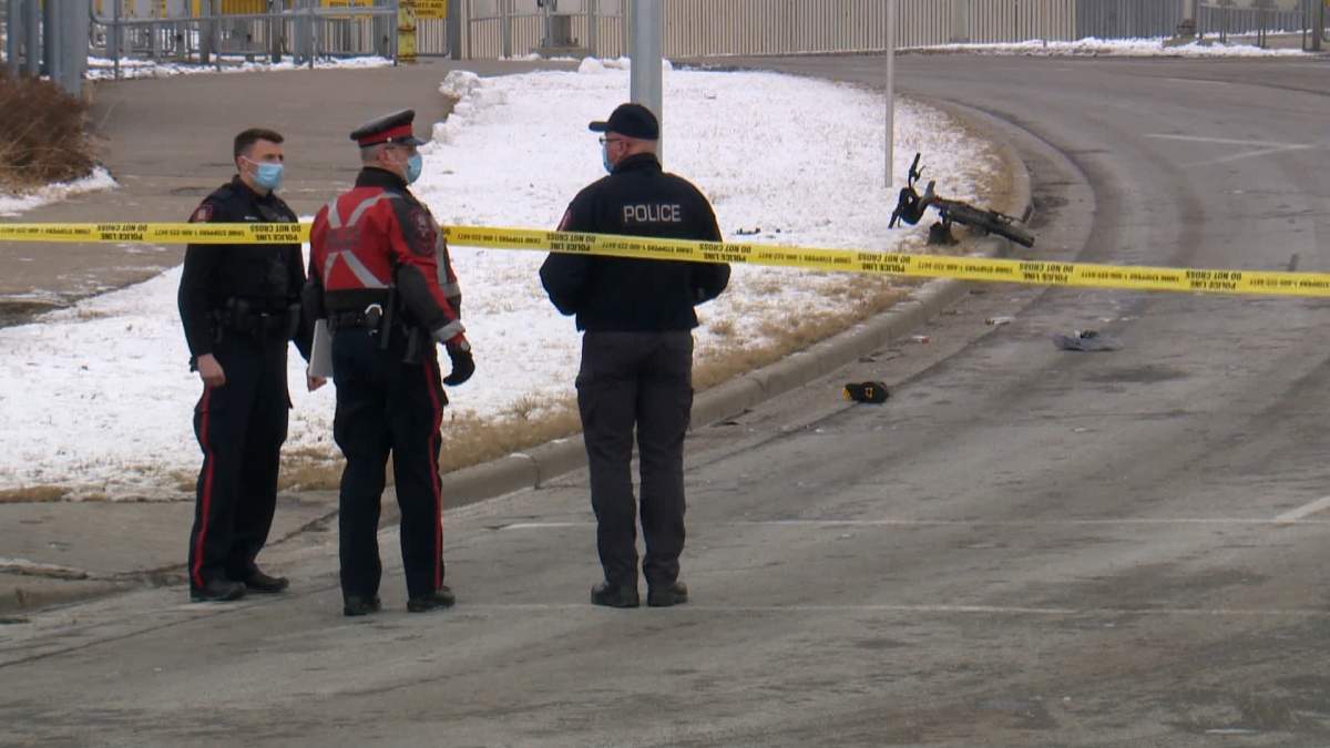Calgary police at the scene of a crash involving a cyclist and a vehicle in northeast Calgary on Tuesday, Dec. 15.