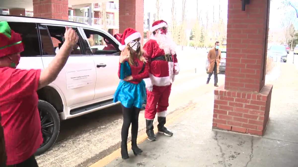 Mable Tooke, also known as SpiderMable, delivers gifts to the Citadel Care Centre in St. Albert on December 21, 2020.