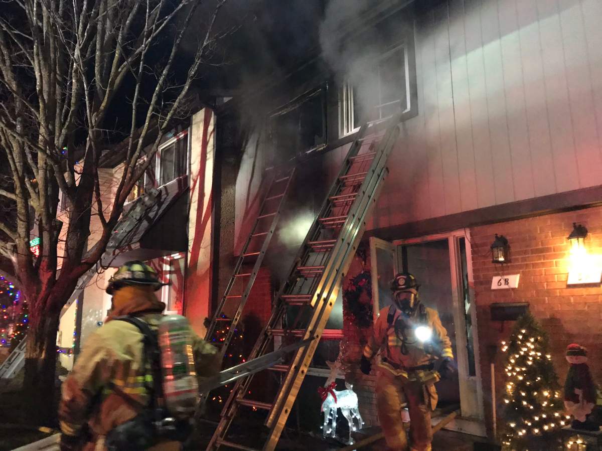 Ottawa fire crews battle a two-alarm blaze at a Barrhaven townhouse on Tuesday, Dec. 16, 2020.