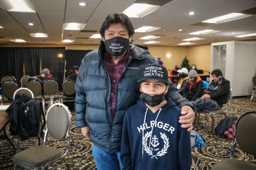 Peter Moonias and his granddaughter Bee Moonias wait in a Thunder Bay hotel on Dec. 19, 2020, prior to their return to Neskantaga.