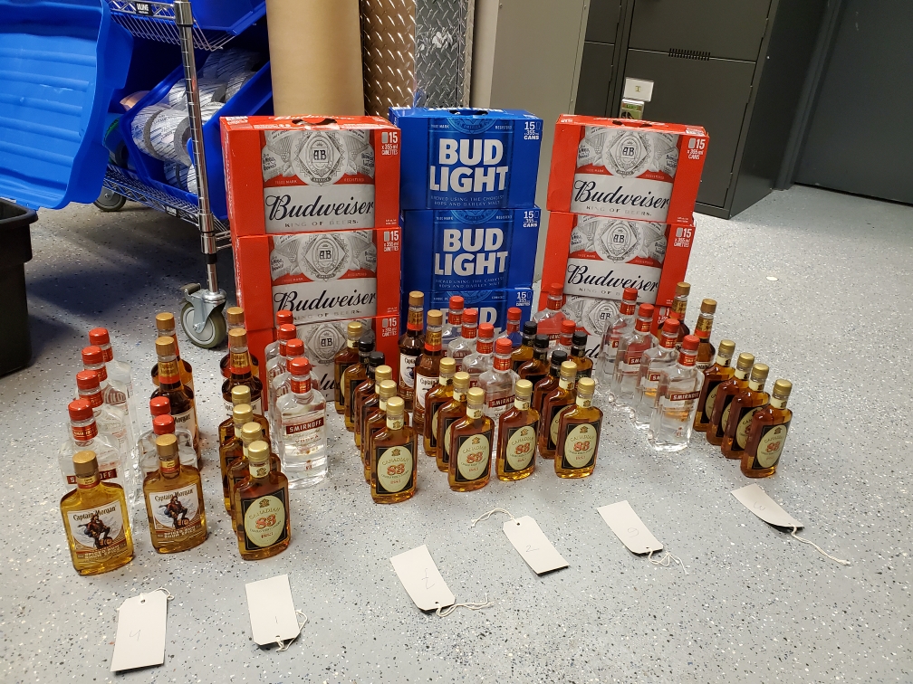 Manitoba RCMP say they seized dozens of bottles of hard liquor and several cases of beer that were allegedly being bought legally and sold at a markup in Thompson.