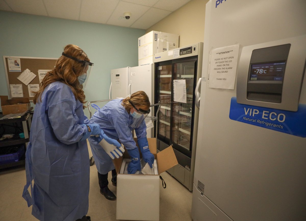 The first shipment of the Pfizer-BioNTech COVID-19 vaccine is unloaded and put into an ultra-cold storage unit at a Calgary vaccination site on the morning of Tuesday, December 15, 2020.