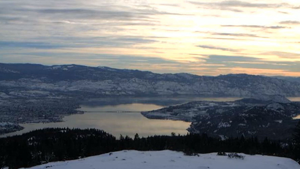 A view of Okanagan Lake, Kelowna and West Kelowna. A Christmas Day storm set to hit the coast will likely bring some snow to the Okanagan by Boxing Day and beyond.