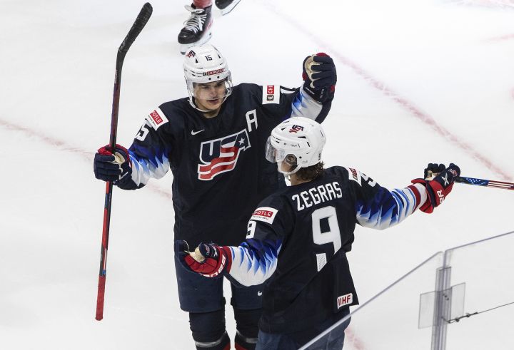 United States' Alex Turcotte (15) and and Trevor Zegras (9) celebrate a goal against the Czech Republic during second period IIHF World Junior Hockey Championship action in Edmonton on Tuesday, December 29, 2020. 