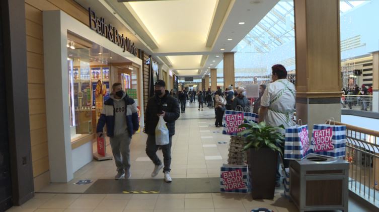 Line up for Bath & Body Works snaking around railings at CF Polo Park Mall