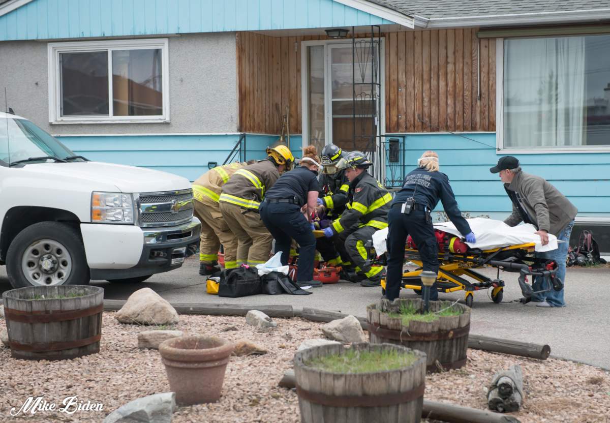 First responders resuscitate a person pulled from a house fire in March 2020.