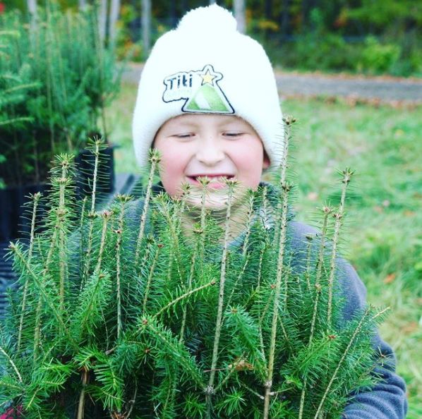 7-year-old Etienne, cultivates tiny potted trees with his father, Martin Ethier.