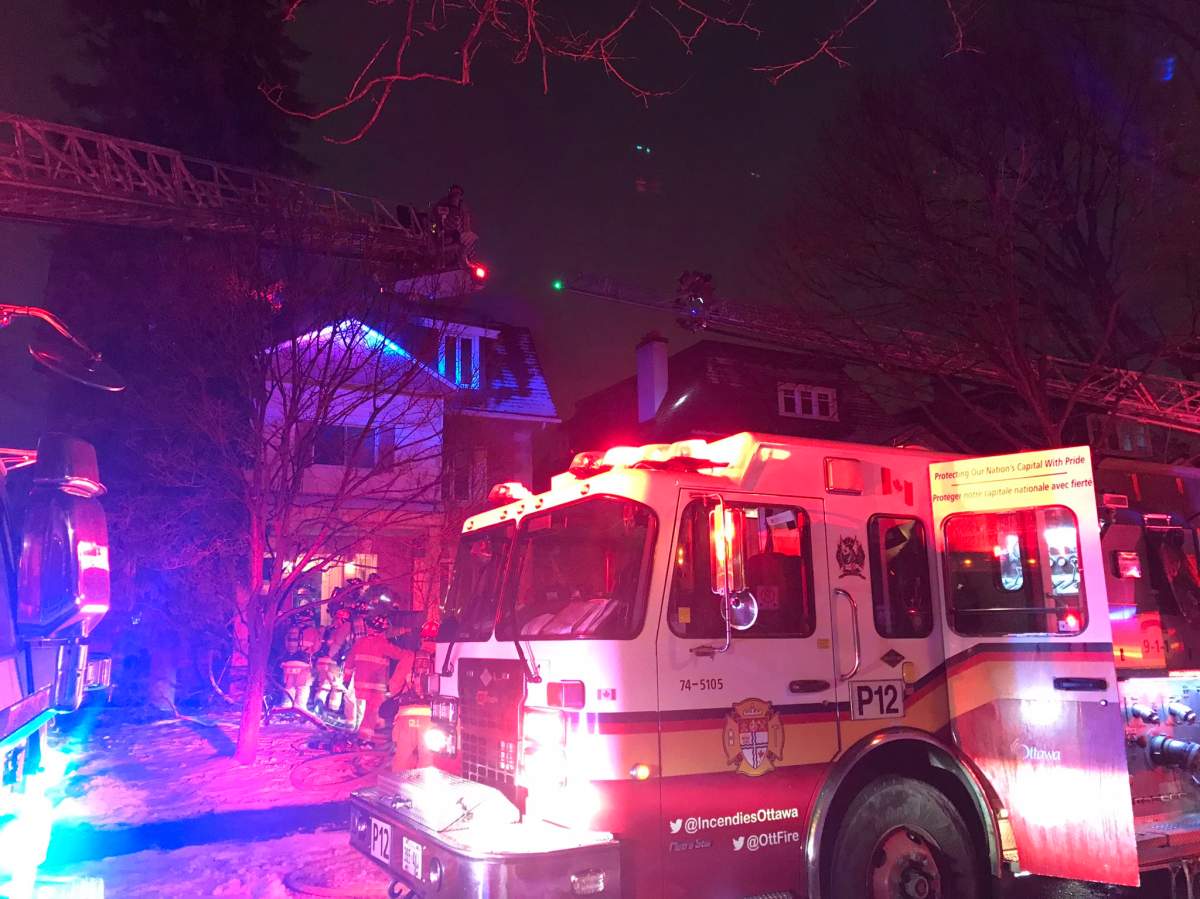 Ottawa fire crews battle a two-alarm blaze on Powell Avenue on Sunday, Dec. 20, 2020.