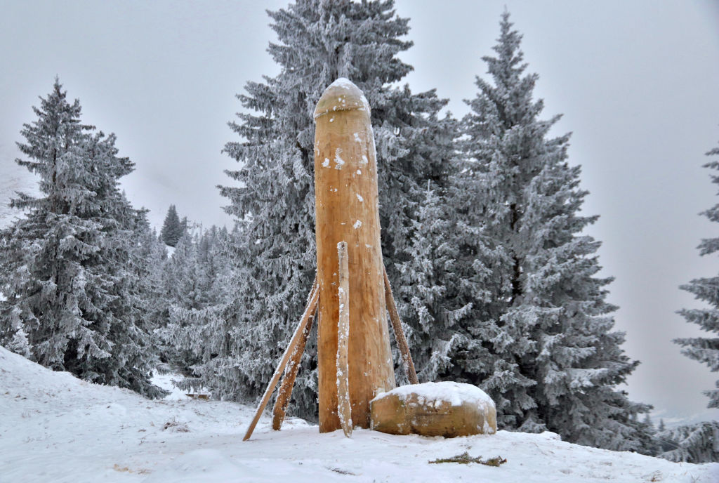 A wooden phallus sculpture about two metres high stands on the Grünten mountain in Germany on Dec. 3, 2020.