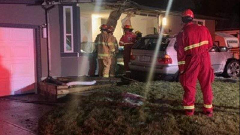 Emergency crews investigate after a vehicle crash into a home at 2055 33 Street Southeast.