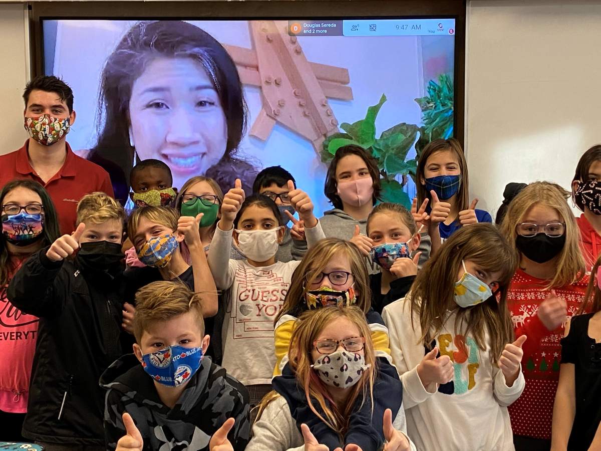 Students pose with Sarah Chan via Zoom