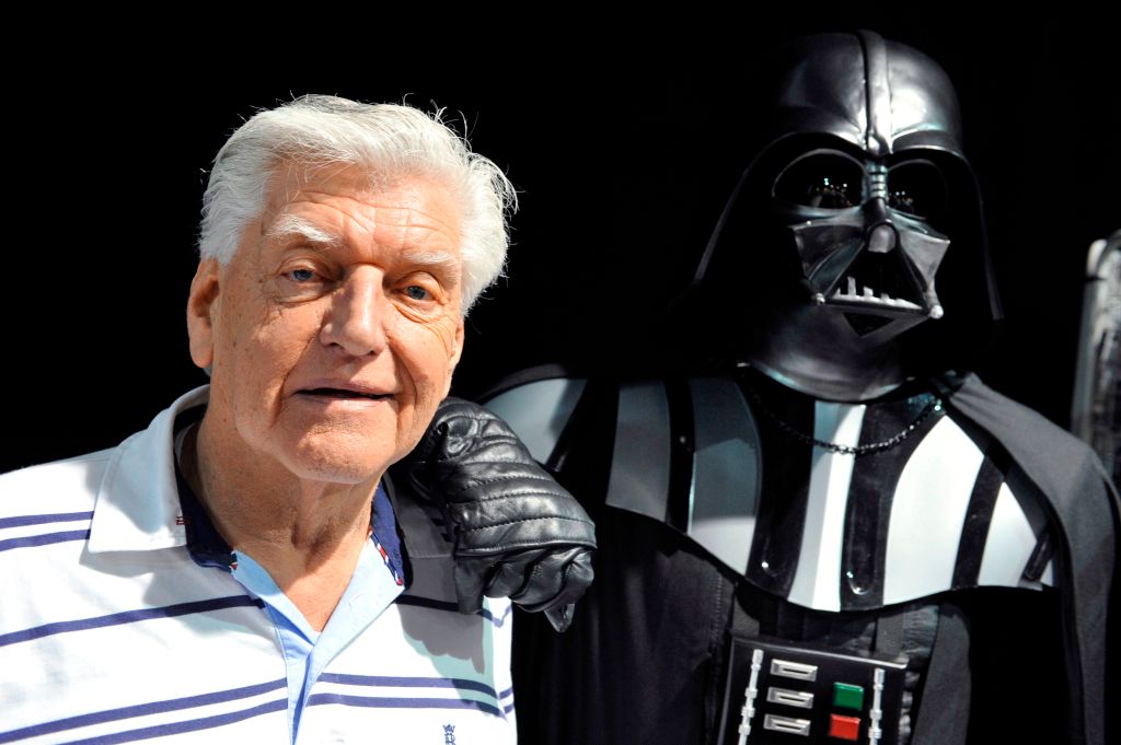 English actor David Prowse is shown with a fan dressed as Darth Vader on Apr. 27, 2013.
