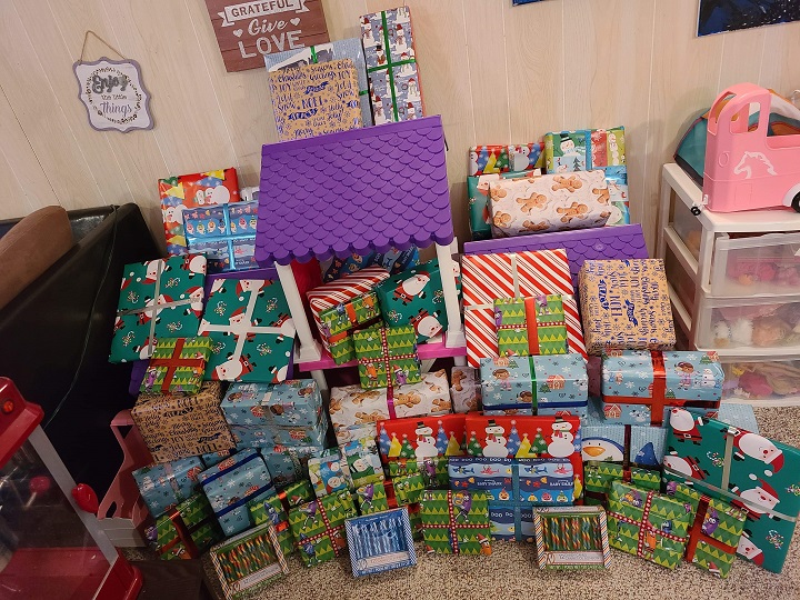 More than 100 presents are wrapped and ready to go.