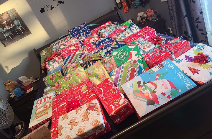 The trio have more than 100 presents wrapped and ready to donate.