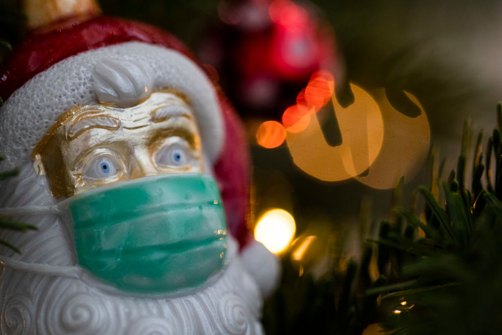 A masked Santa Claus ornament is shown in this Dec. 15, 2020 file photo.