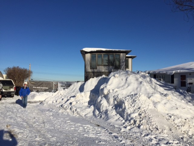The snow pile is blocking the driveway and sidewalk of Garry Schmidt in N.E. Calgary.
