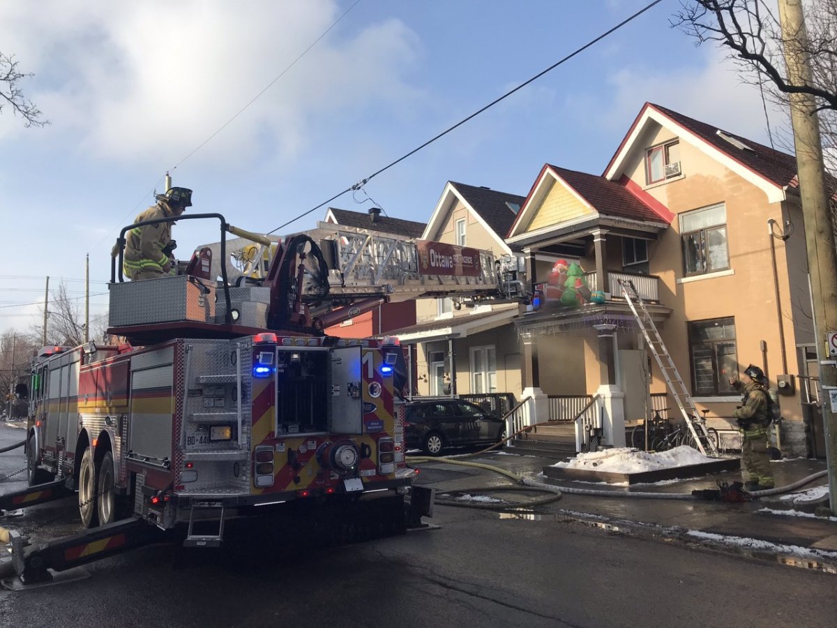 Ottawa fire crews douse a blaze on James Street on Monday, Dec. 21, 2020, the fifth fire in the city since Sunday evening.