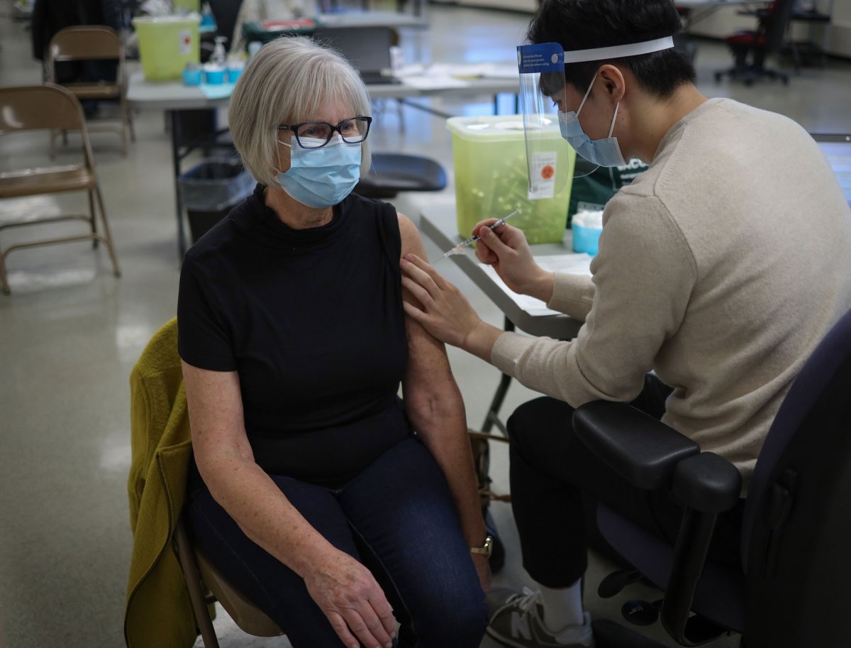 RN Sharon Dunn receives the COVID-19 vaccine in Calgary Jan. 22, 2021. 