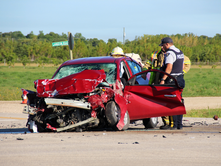 Dramatic video shows car accident near miss with family crossing