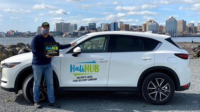 Brian MacDonald, pictured here on the Dartmouth side of the Halifax Harbour, launched HaliHub Food Delivery to reduce the fees restaurants pay to online ordering and delivery companies and to keep the money local. 