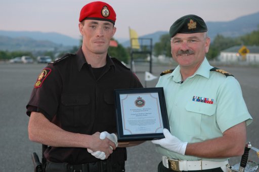 A photo from 2007 showing Andrew Harnett, left, receiving a commanding officers commendation award.