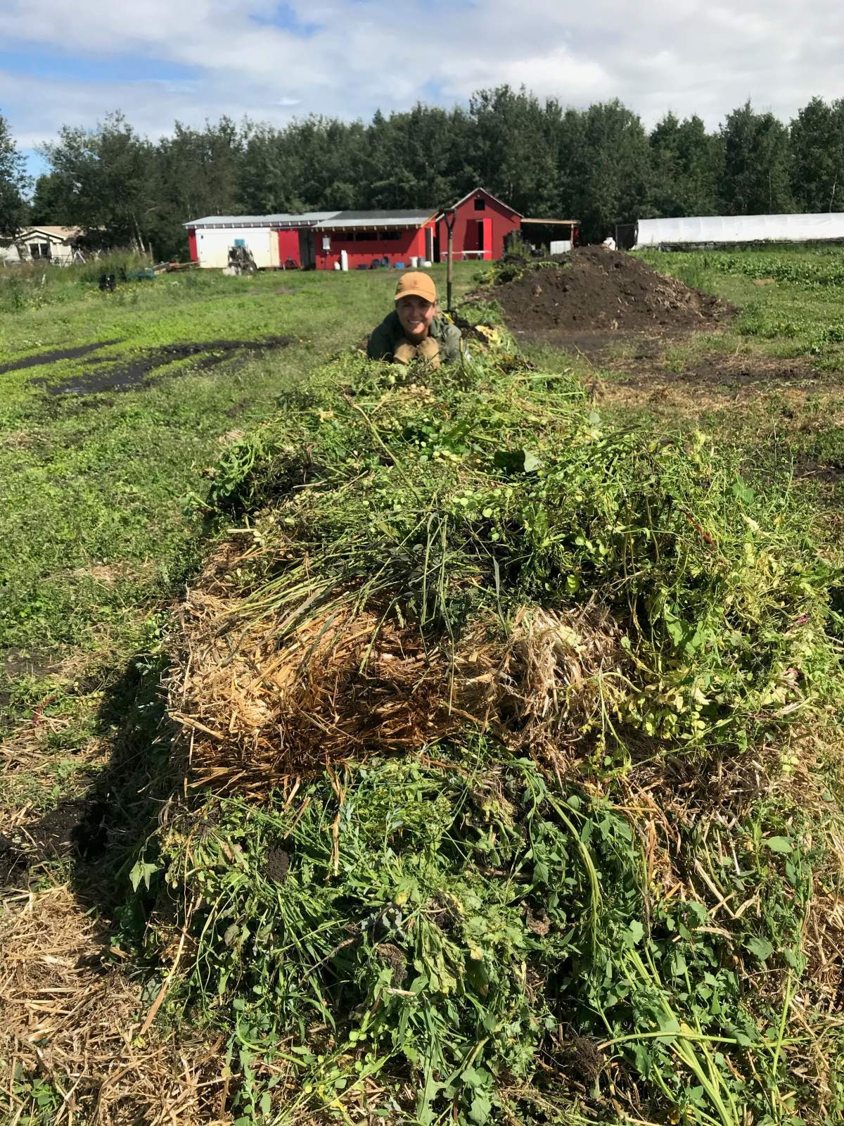 Jillian Barvir building her first compost pile