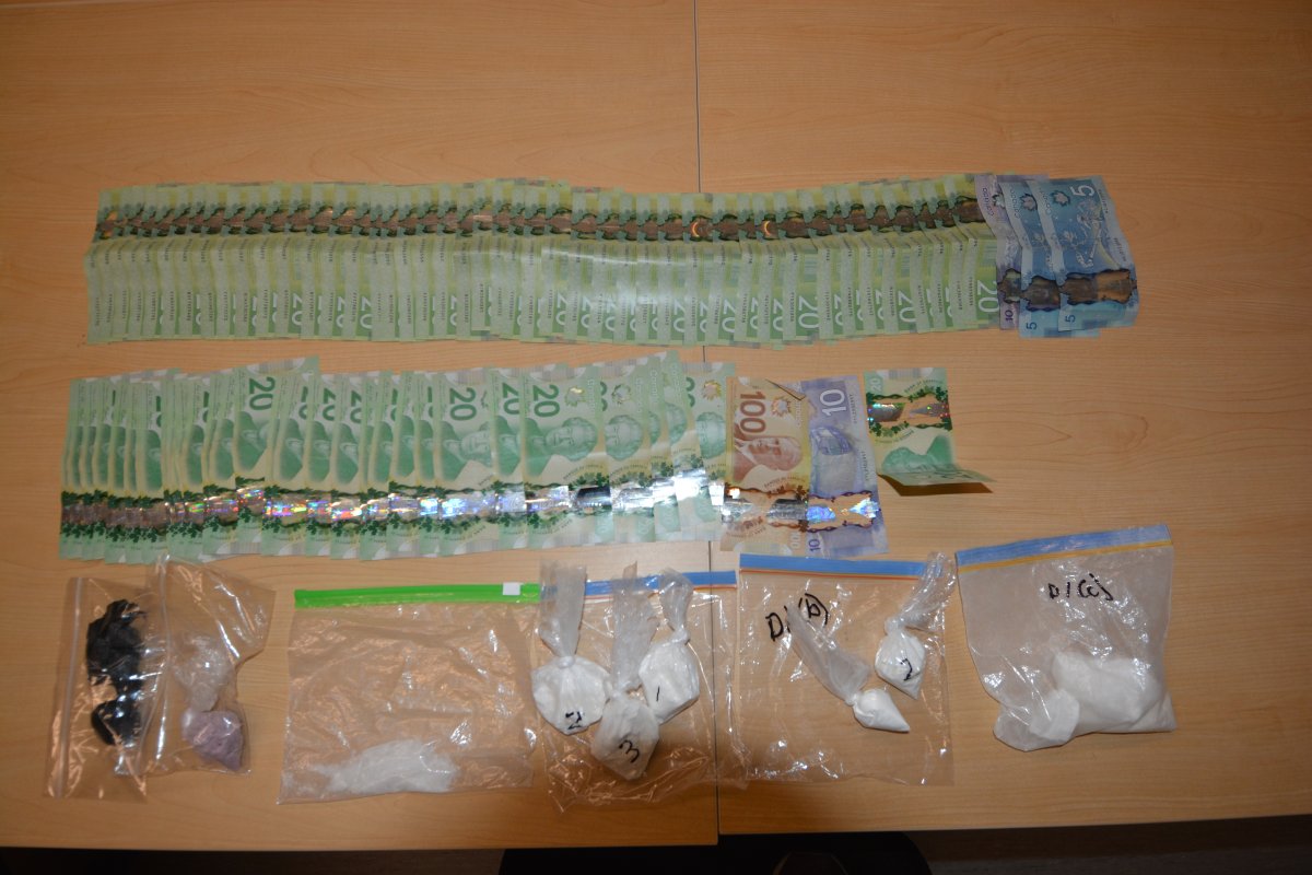 Belleville police say they made five arrests and seized a large quantity of various drugs during two searches in the city Wednesday. 