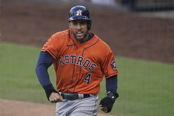File-This Oct 16, 2020, file photo shows Houston Astros George Springer reacts after scoring on a single by Jose Altuve against the Tampa Bay Rays during the fifth inning in Game 6 of a baseball American League Championship Series in San Diego. 