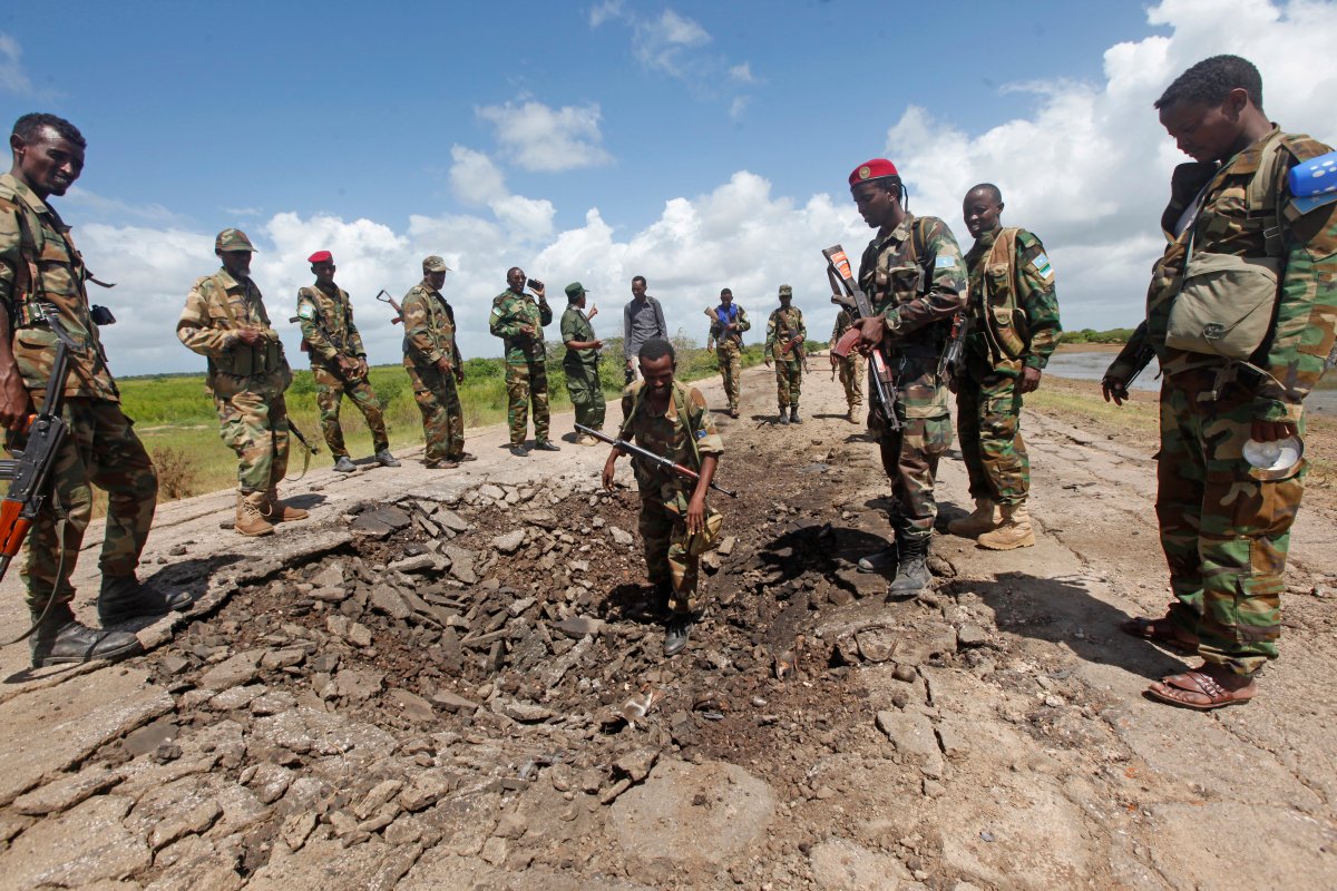 In this June 13, 2018 file photo, Somali soldiers stand at a Somali military base, near the site of an attack by al-Shabab in which a US soldier was killed and four others were injured in Somalia. 