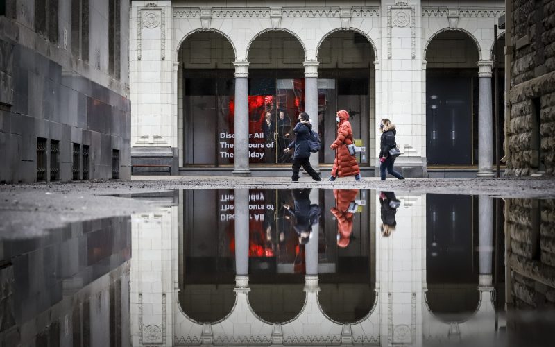 Pedestrians wearing masks walk through an empty downtown Calgary, Alta., Wednesday, Dec. 9, 2020.