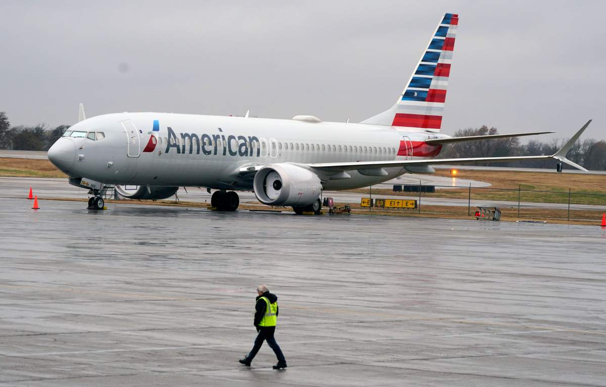 FILE - In this Dec. 2, 2020 file photo, an American Airlines Boeing 737 Max jet plane is parked at a maintenance facility in Tulsa, Okla.