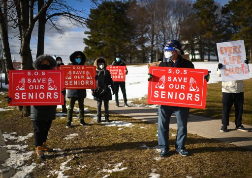People protest outside the Tendercare Living Centre long-term-care facility during the COVID-19 pandemic in Scarborough, Ont., on Dec. 29, 2020. The LTC home was hit hard by the coronavirus during the second wave.