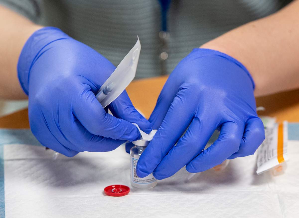 Amanda Parsons, a registered nurse on staff at the Northwood Care facility, prepares a dose of the Moderna vaccine in Halifax on Monday, Jan. 11, 2021. 