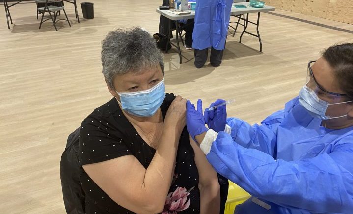 Veronica Apetagon receives the Moderna vaccine as doses arrived in Norway House Cree Nation in Manitoba on Jan. 7, 2021.