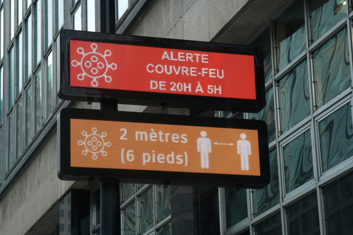 Sign indicating a province wide night time curfew in effect from 20:00-5:00 0n account of the COVID-19 pandemic in Montreal, Que., Wednesday, January 13, 2021. 