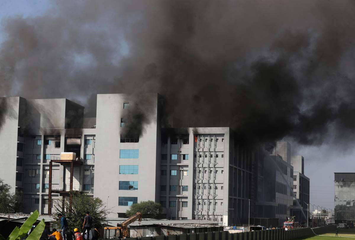 Firemen try to douse a fire at Serum Institute of India, the world's largest vaccine maker that is manufacturing the AstraZeneca/Oxford University vaccine for the coronavirus, in Pune, India, Thursday, Jan. 21, 2021.