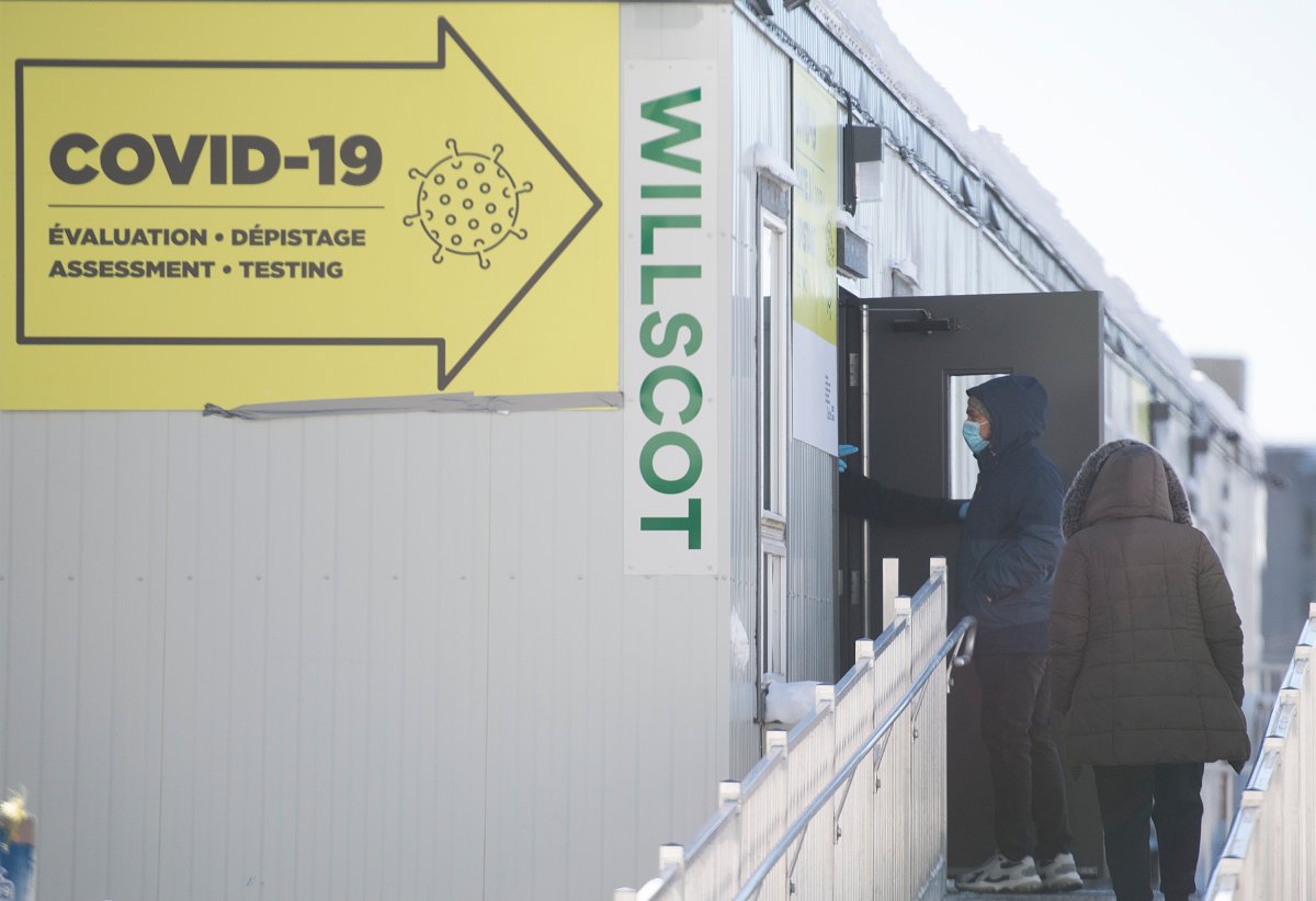 People arrive to be tested for COVID-19 at a clinic in Montreal, Sunday, January 24, 2021, as the COVID-19 pandemic continues in Canada and around the world. 