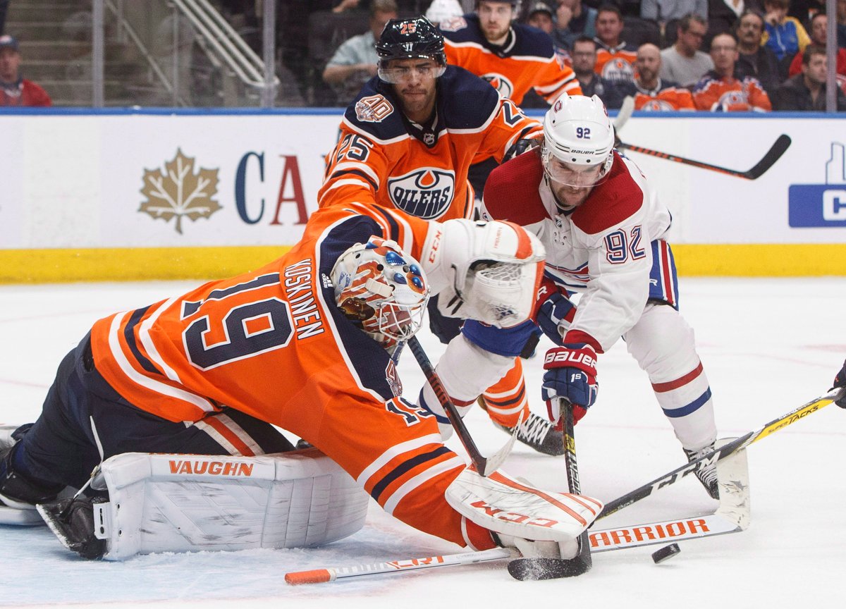 Montreal Canadiens' Jonathan Drouin (92) is stopped by Edmonton Oilers' goalie Mikko Koskinen (19) as Darnell Nurse (25) defends during third period NHL action in Edmonton, Alta., on Tuesday November 13, 2018. THE CANADIAN PRESS/Jason Franson.