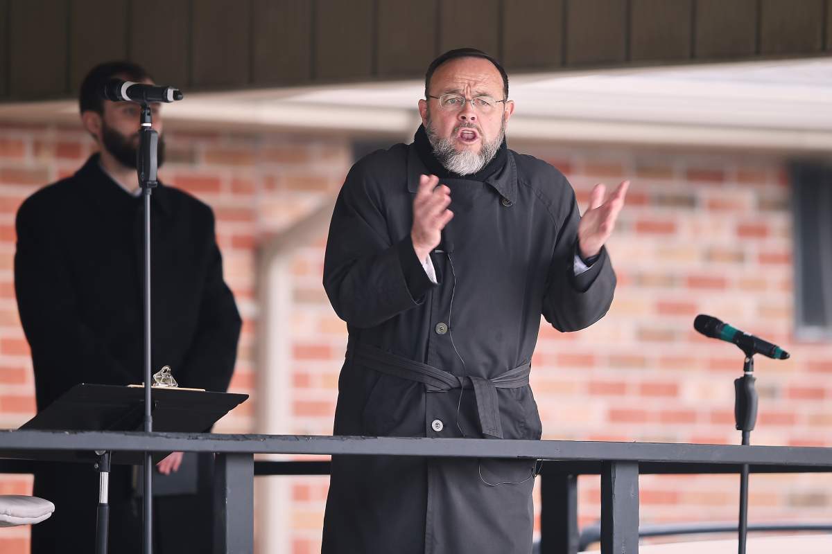 Pastor Henry Hildebrandt speaks during a drive in Sunday service at The Church of God in Aylmer, Ont. on Sunday, April 26, 2020. 