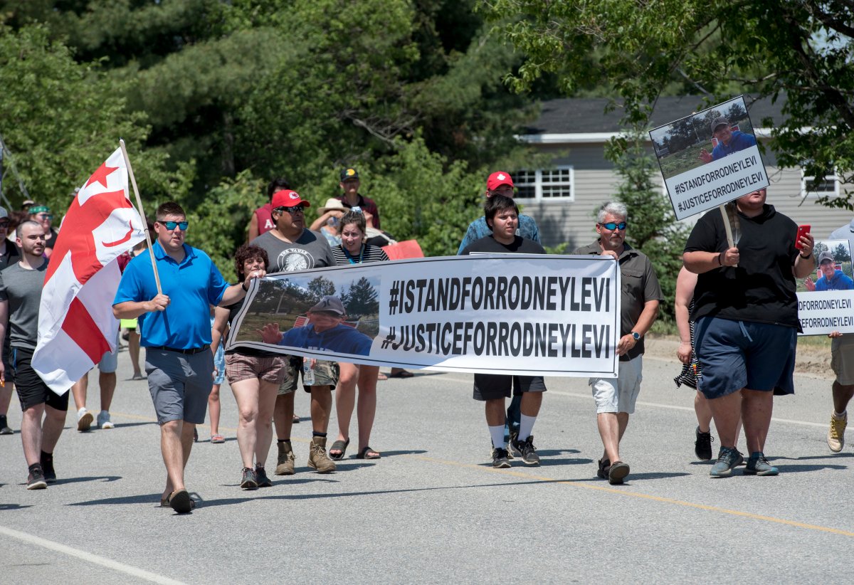 People walk to honour Rodney Levi in Red Bank, New Brunswick on Friday June 19, 2020. THE CANADIAN PRESS/Stephen MacGillivray.