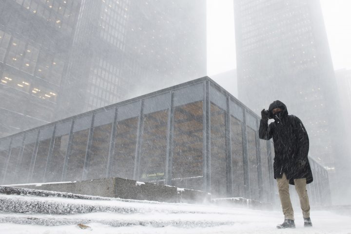 A pedestrian braves blowing snow as a storm moved in Toronto on Monday, January 28, 2019.