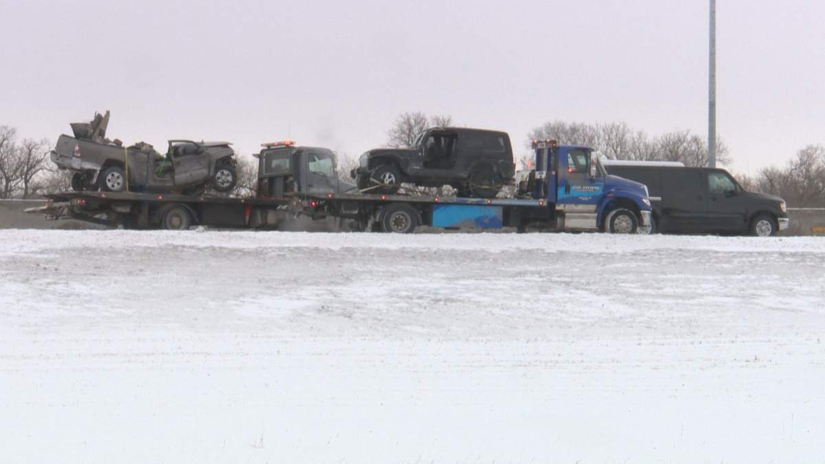 A pair of vehicles about to be hauled away from the scene of a fatal collision on Winnipeg’s Perimeter Highway Monday morning.