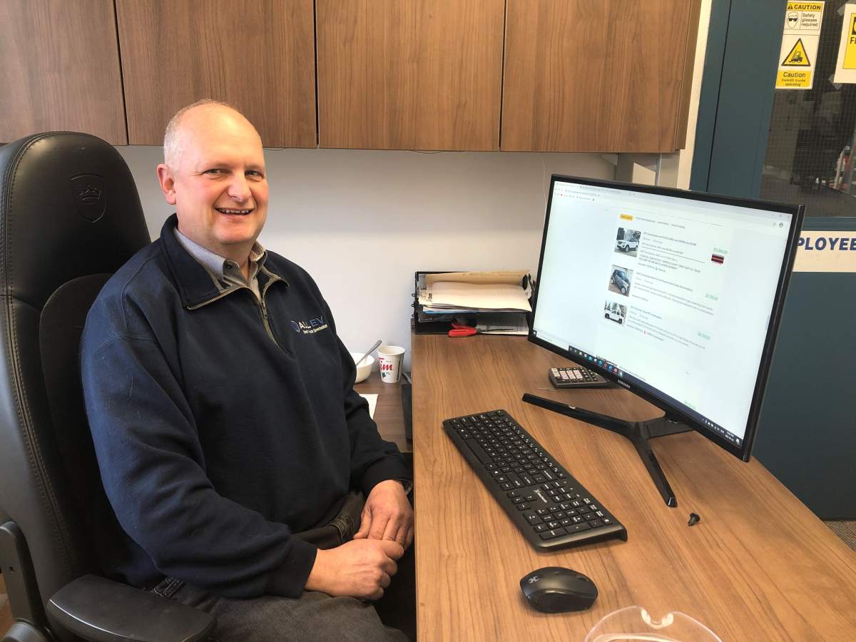 Dave Giles, vice-president of operations and trade at All EV Canada in Dartmouth, N.S. looks up ex-police vehicles for sale online, and finds some that still have police equipment attached.