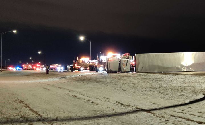 A photo of a UPS semi-truck flipped on its side north of 41 Avenue S.W. on Tuesday night. Powerful wind gusts tore through the Edmonton region on Tuesday night as the city was under a snow squall warning.